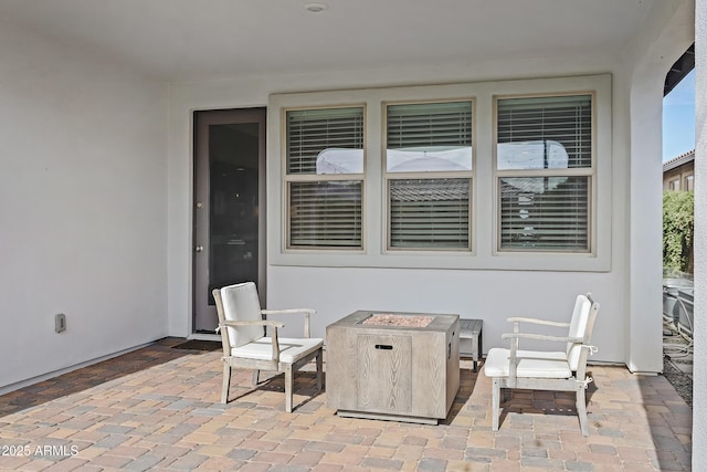 view of patio with a fire pit