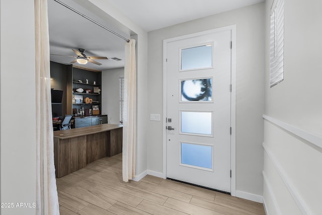 foyer with ceiling fan