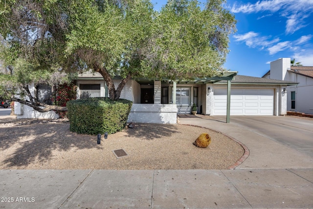 view of front of house featuring driveway and a garage