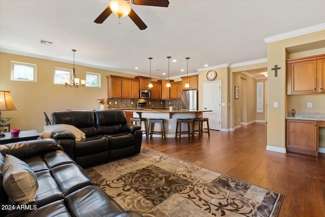 856 E Harmony Way, San Tan Valley, AZ 85140 - living area with a chandelier, a ceiling fan, dark wood-type flooring, crown molding, and recessed lighting