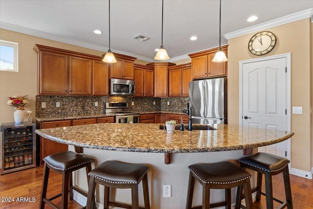 856 E Harmony Way, San Tan Valley, AZ 85140 - kitchen with stainless steel appliances, beverage cooler, a sink, brown cabinetry, and dark wood finished floors