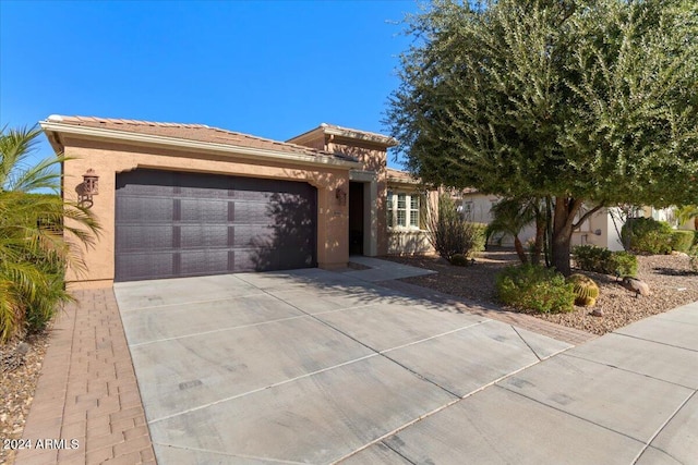 ranch-style house featuring a garage