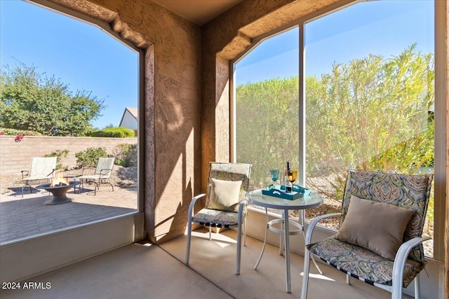 856 E Harmony Way, San Tan Valley, AZ 85140 - sunroom / solarium with a fire pit and plenty of natural light
