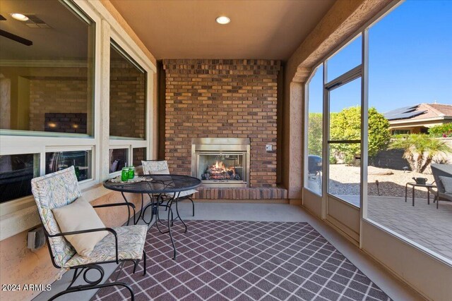 856 E Harmony Way, San Tan Valley, AZ 85140 - sunroom / solarium featuring a fireplace