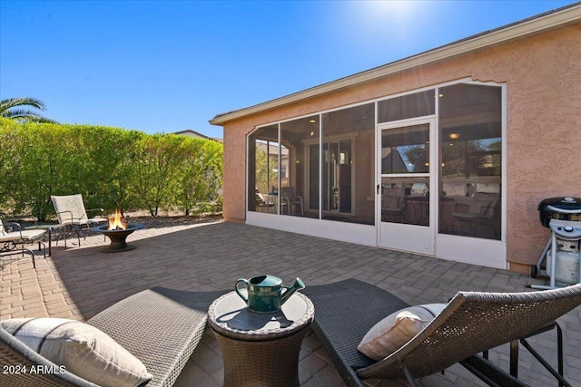 856 E Harmony Way, San Tan Valley, AZ 85140 - view of patio / terrace with a sunroom and an outdoor fire pit