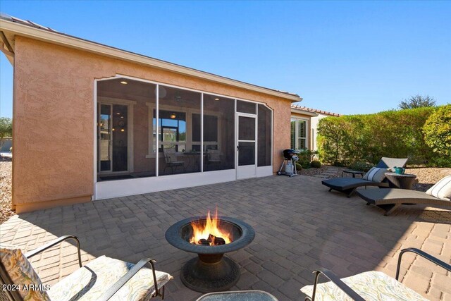 856 E Harmony Way, San Tan Valley, AZ 85140 - view of patio featuring a sunroom and a fire pit