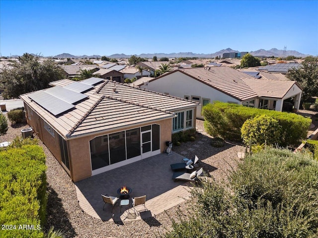 856 E Harmony Way, San Tan Valley, AZ 85140 - rear view of house with a fire pit, solar panels, stucco siding, and a patio