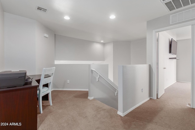 carpeted office space featuring baseboards, visible vents, and recessed lighting