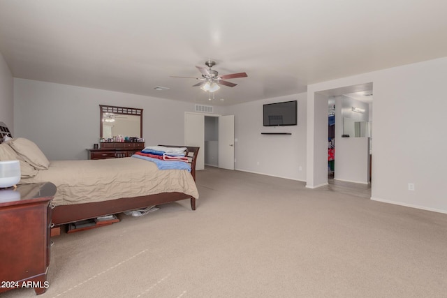 bedroom featuring carpet, visible vents, a spacious closet, ceiling fan, and baseboards