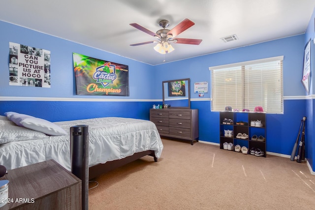 bedroom with ceiling fan, carpet flooring, visible vents, and baseboards