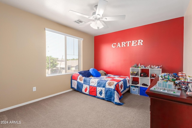 bedroom featuring carpet floors, baseboards, visible vents, and ceiling fan