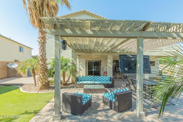 view of patio featuring ceiling fan, an outdoor living space, and a pergola