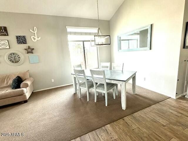 dining room featuring baseboards and wood finished floors