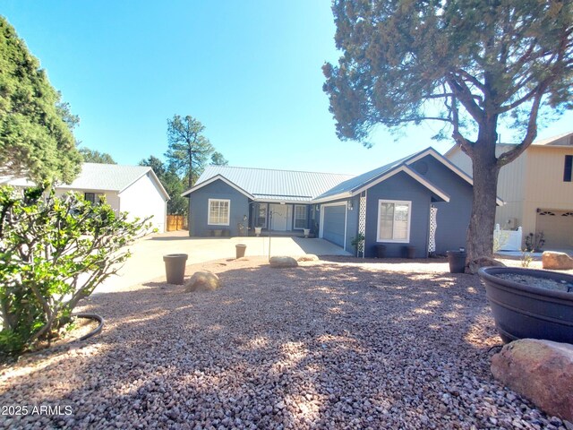 513 W Sherwood Dr, Payson, AZ 85541 - view of front of home with metal roof and an attached garage