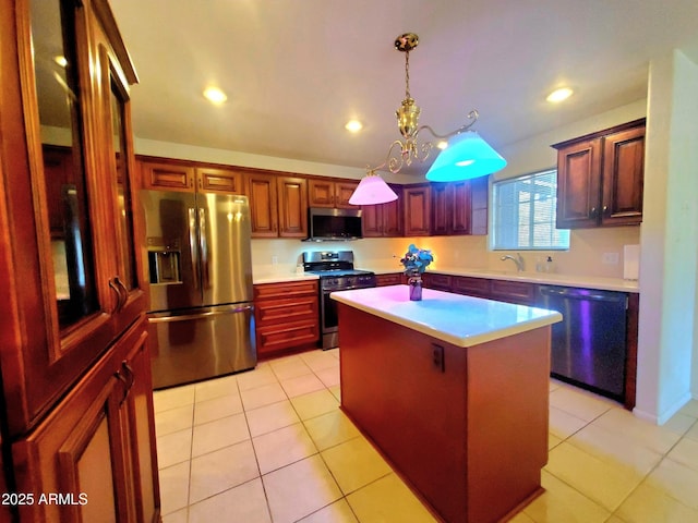 513 W Sherwood Dr, Payson, AZ 85541 - kitchen featuring decorative light fixtures, a center island, light countertops, and stainless steel appliances