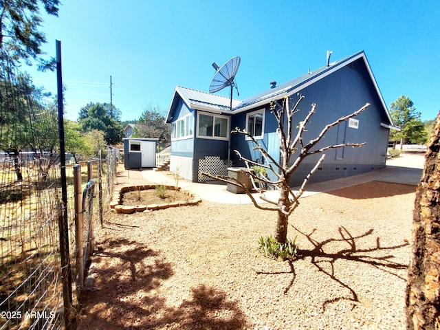 513 W Sherwood Dr, Payson, AZ 85541 - rear view of house with a shed, metal roof, fence, and an outdoor structure