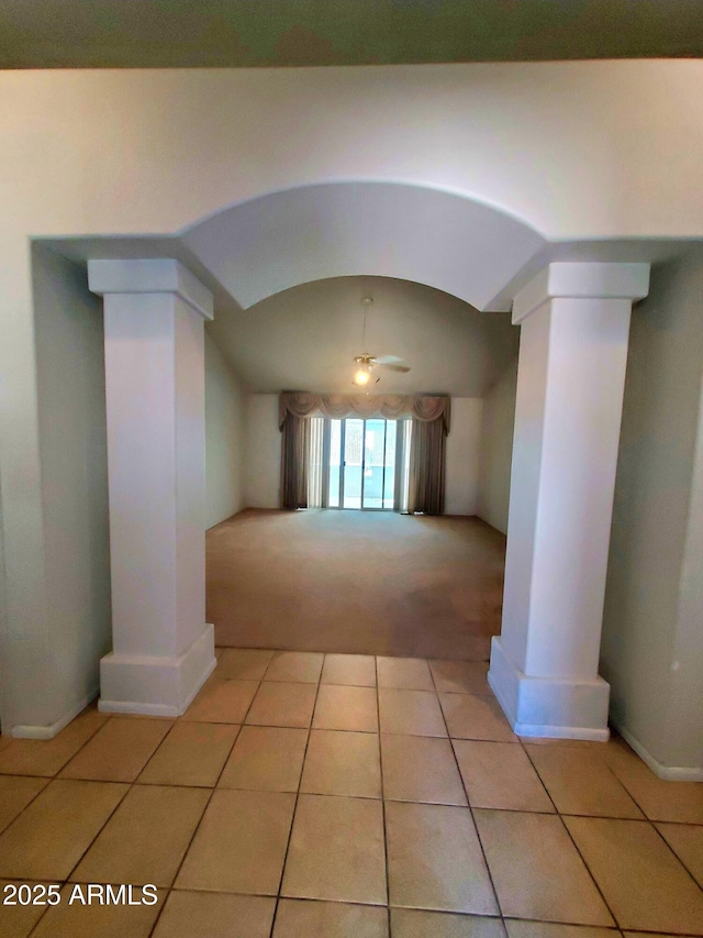 513 W Sherwood Dr, Payson, AZ 85541 - interior space featuring light tile patterned floors, ornate columns, arched walkways, light carpet, and lofted ceiling