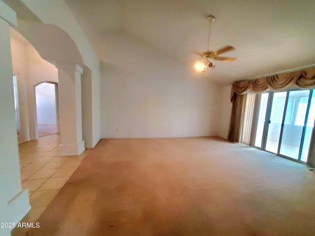 513 W Sherwood Dr, Payson, AZ 85541 - spare room featuring light tile patterned floors, arched walkways, light colored carpet, a ceiling fan, and lofted ceiling