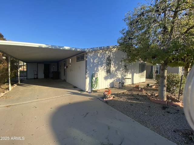 view of side of home featuring a carport