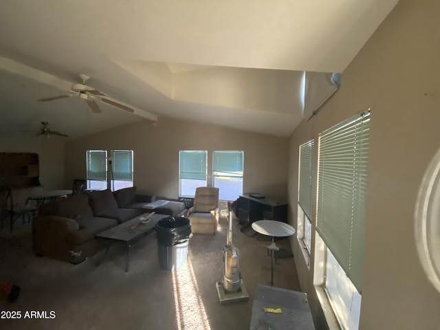 living room featuring ceiling fan and vaulted ceiling with beams