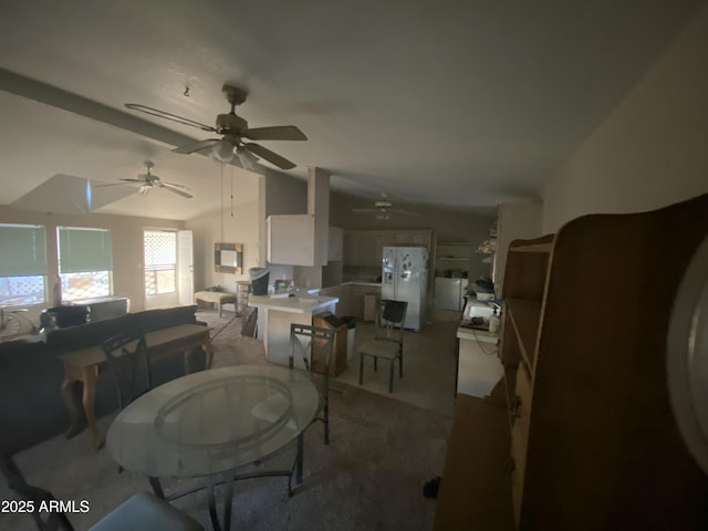 dining space with ceiling fan and vaulted ceiling