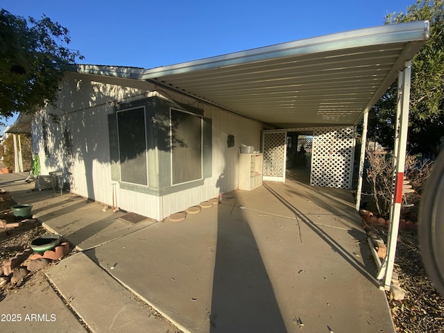 view of home's exterior with a carport