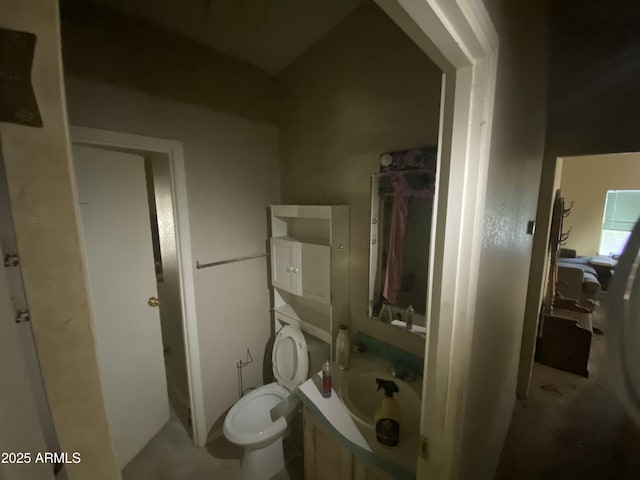 bathroom with toilet and vanity