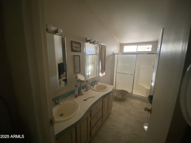 bathroom featuring toilet, walk in shower, vanity, and lofted ceiling