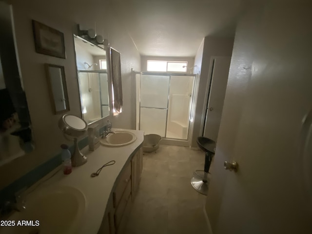 bathroom with toilet, an enclosed shower, and vanity