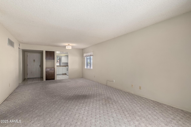 11026 N 28th Dr Unit 81, Phoenix, AZ 85029 - unfurnished room with light carpet and a textured ceiling