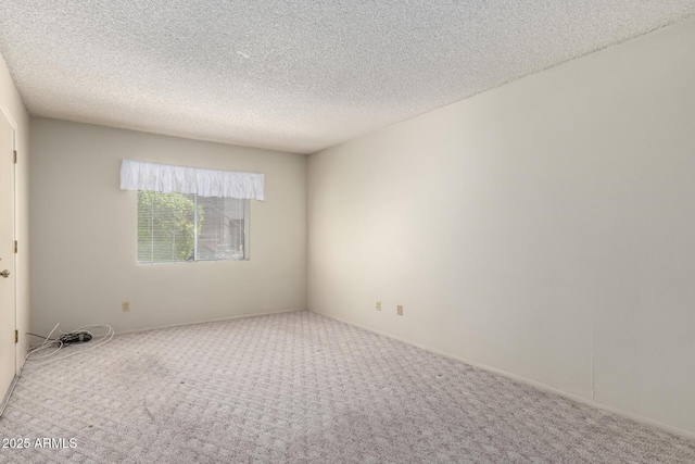 11026 N 28th Dr Unit 81, Phoenix, AZ 85029 - unfurnished room featuring carpet floors and a textured ceiling