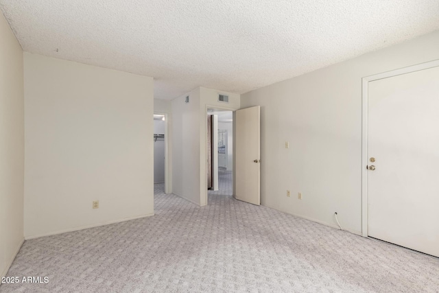 11026 N 28th Dr Unit 81, Phoenix, AZ 85029 - carpeted empty room featuring a textured ceiling