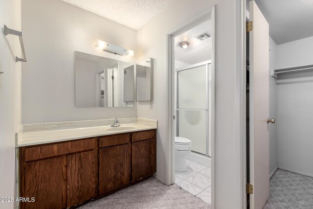 11026 N 28th Dr Unit 81, Phoenix, AZ 85029 - bathroom with a shower stall, vanity, and a textured ceiling
