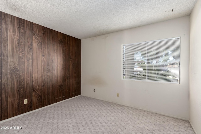 11026 N 28th Dr Unit 81, Phoenix, AZ 85029 - carpeted empty room featuring wood walls and a textured ceiling