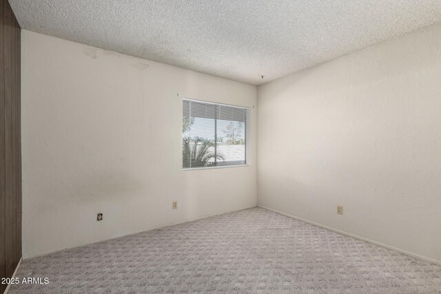 11026 N 28th Dr Unit 81, Phoenix, AZ 85029 - unfurnished room featuring carpet flooring and a textured ceiling