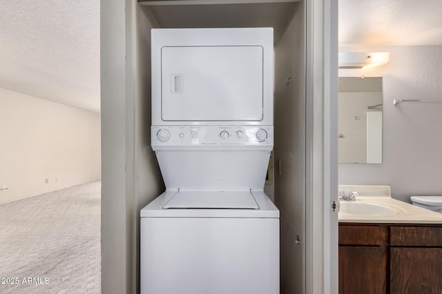 11026 N 28th Dr Unit 81, Phoenix, AZ 85029 - washroom featuring stacked washing machine and dryer and carpet