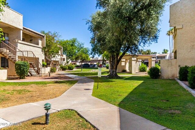11026 N 28th Dr Unit 81, Phoenix, AZ 85029 - view of home's community featuring stairs, a lawn, and a residential view