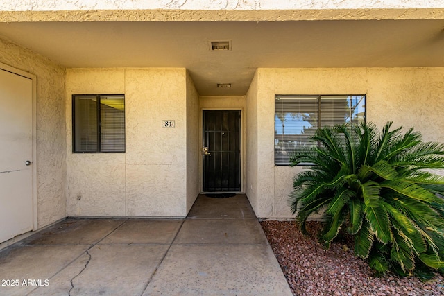 11026 N 28th Dr Unit 81, Phoenix, AZ 85029 - doorway to property with stucco siding and a patio area