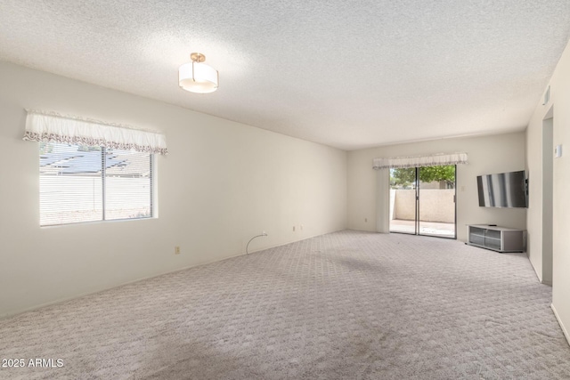 11026 N 28th Dr Unit 81, Phoenix, AZ 85029 - carpeted empty room with a textured ceiling
