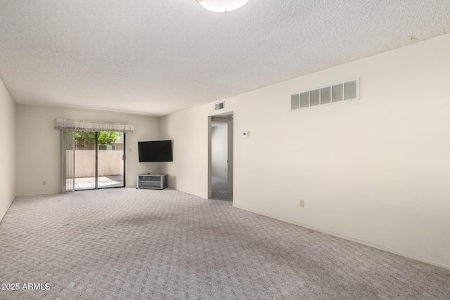 11026 N 28th Dr Unit 81, Phoenix, AZ 85029 - unfurnished living room featuring carpet floors and a textured ceiling