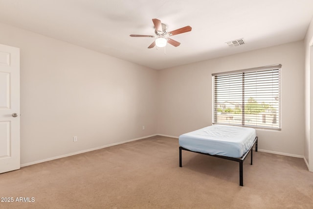 466 N 10th Pl, Coolidge, AZ 85128 - bedroom with light carpet and a ceiling fan