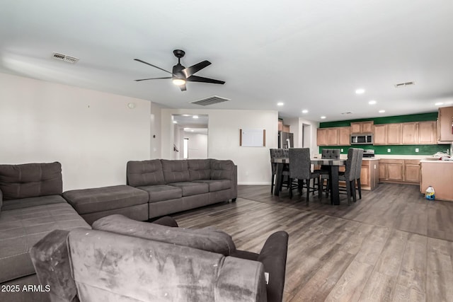 466 N 10th Pl, Coolidge, AZ 85128 - living room featuring wood finished floors, ceiling fan, and recessed lighting