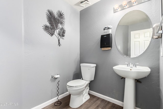 466 N 10th Pl, Coolidge, AZ 85128 - bathroom featuring toilet and wood finished floors