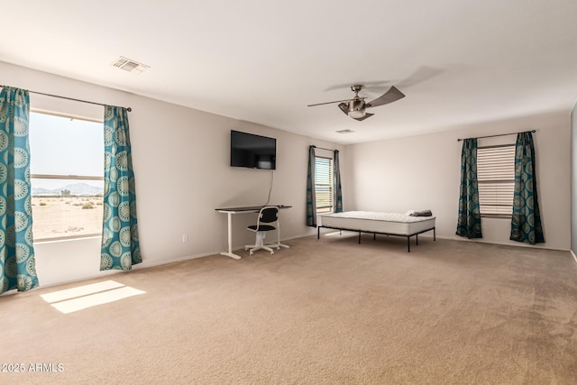 466 N 10th Pl, Coolidge, AZ 85128 - bedroom with light colored carpet and ceiling fan