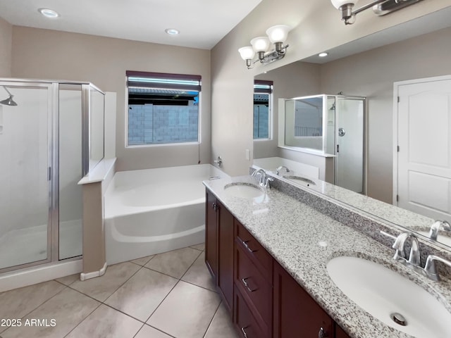 bathroom featuring a stall shower, a sink, and a bath