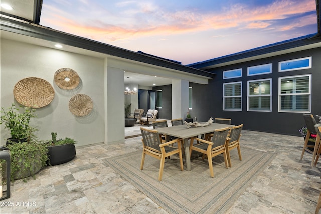 view of patio terrace at dusk