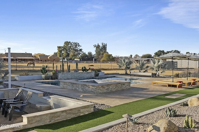 view of swimming pool with a patio area