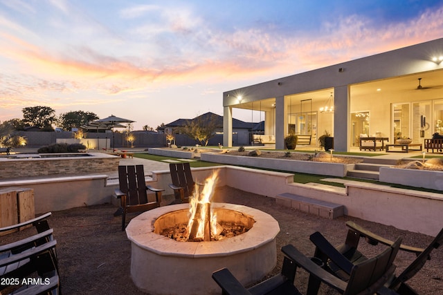 patio terrace at dusk with a fire pit