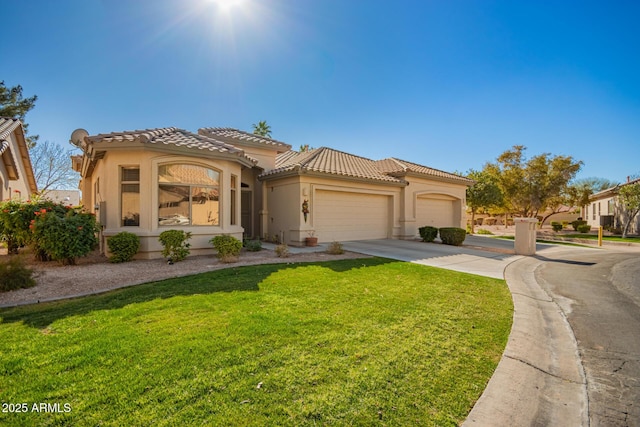 mediterranean / spanish-style home featuring a garage and a front lawn