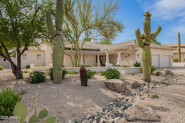 22756 N 91st Way, Scottsdale, AZ 85255 - view of front of house with an attached garage and stucco siding